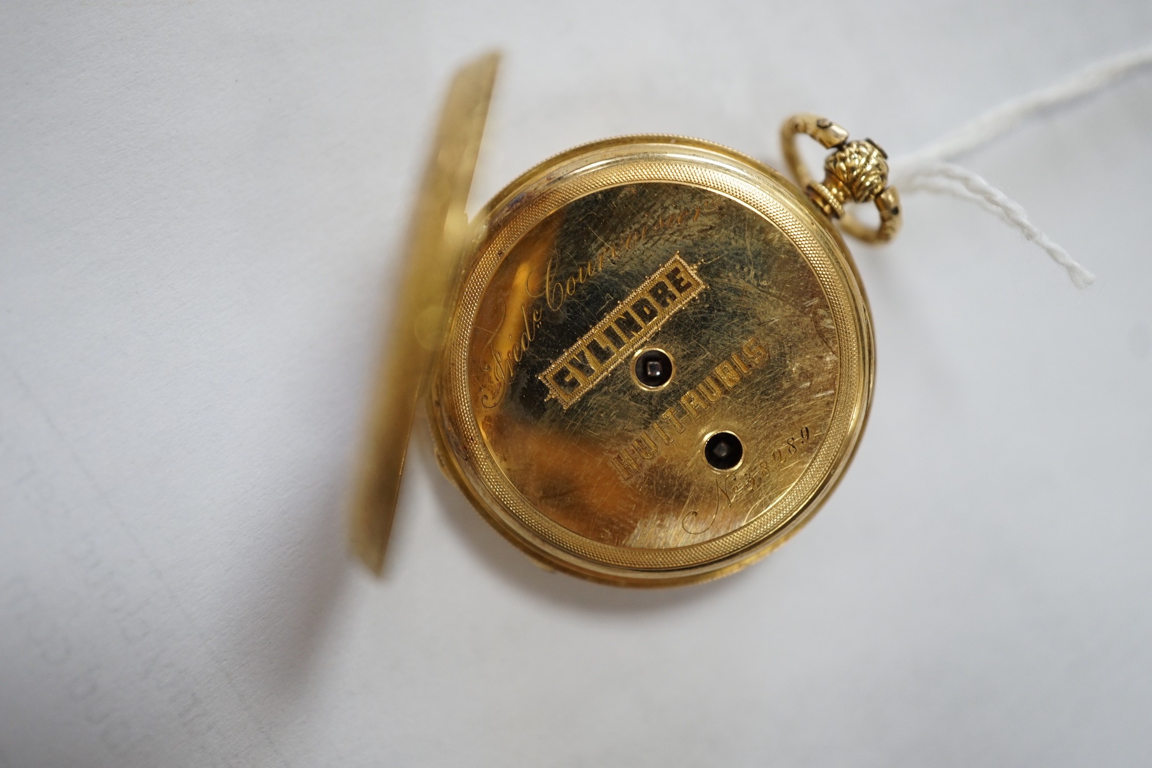 An early 20th century Swiss 18k and enamelled fob watch, decorated with the bust of a young girl and flowers verso, case diameter 33mm, gross weight 27.3 grams.